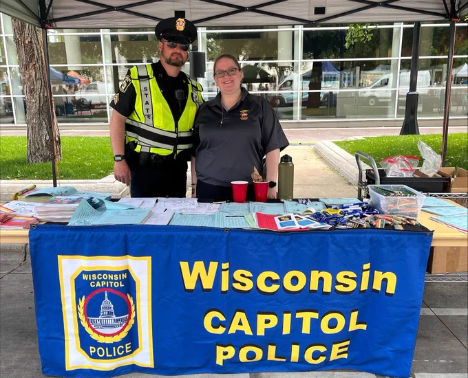 Wisconsin Capitol Police Sergeant Adam Haas alongside Katelynn Updike at the Capitol Square for Safety Saturday 2025. 