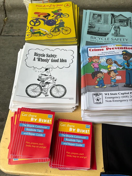 A variety of books about safety on the Wisconsin Capitol Police table at the 2025 Safety Saturday event at the Capitol Square.
