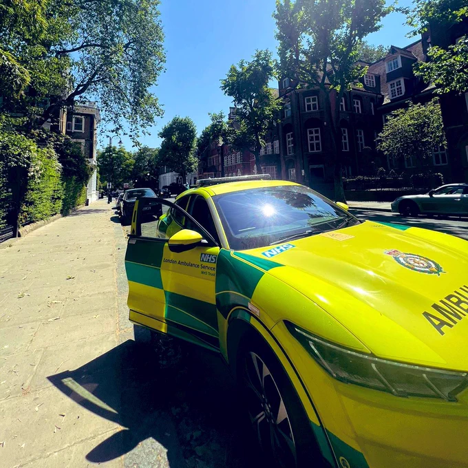 A fast-response car parked on a residential street during a heatwave. 