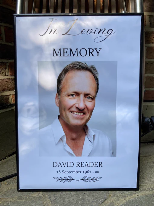 Poster of a man with the words: 'In Loving Memory, David Reader, 18 September 1961 - ∞'