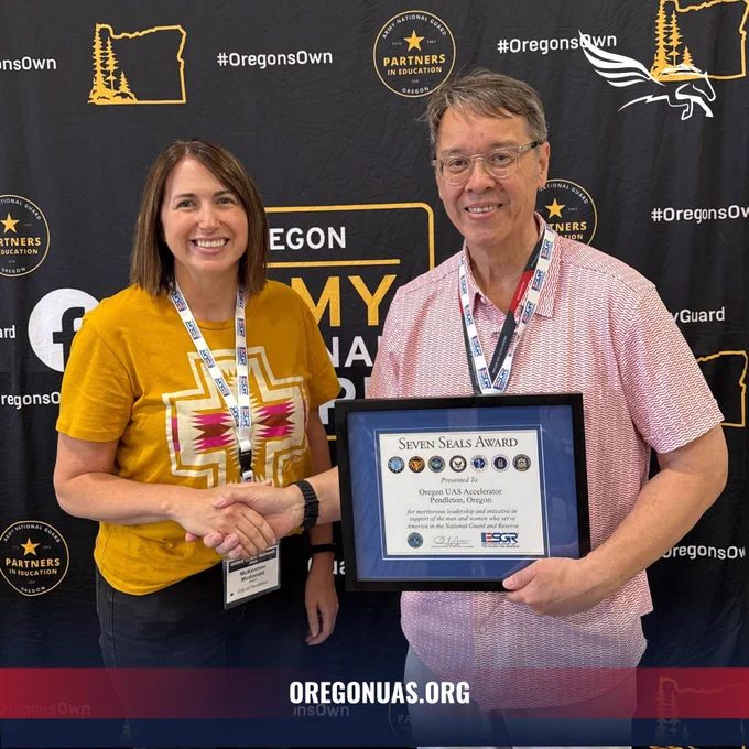 Joseph Wyno, Executive Director of the Oregon UAS Accelerator, stands with Mayor McKennon McDonald of Pendleton, Oregon, at the ORNG Labor Summit 2025.

