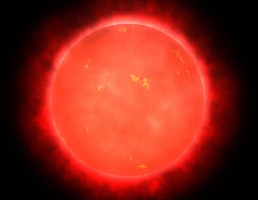 Illustration of a red dwarf star glowing with a deep red hue, surrounded by a faint red corona. The surface appears smooth with subtle yellowish patches, indicating cooler temperatures and minimal solar activity.