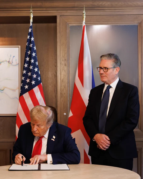 Prime Minister Keir Starmer and US President Donald  Trump sign a trade agreement as they attend the G7 Summit in the Kananaskis mountain lodge in Canada.