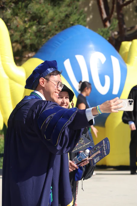 Two graduates taking a selfie before graduation
