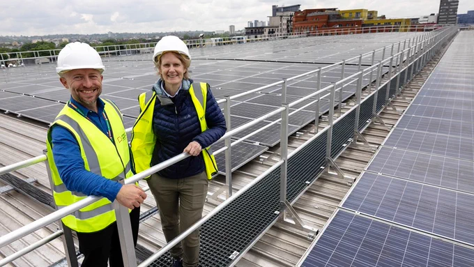 Cllr Rowena Champion (pictured right) and Martijn Cooijmans (pictured left), Islington Council Director of Climate Change and Transport, pose on the roof of the Islington Waste and Recycling Centre