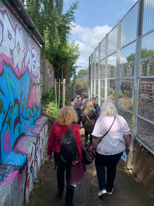 Guided walk attendees walking through the local Underpass. 