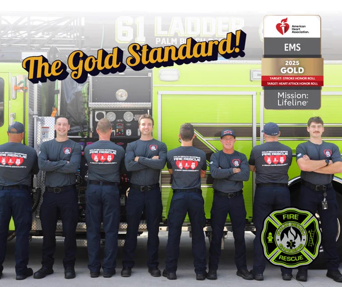 The Gold Standard. Palm Beach Gardens Fire Rescue crew stands with their arms across their chests while wearing American Heart Month shirts.