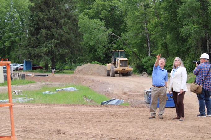 Engineer Jack Dodson points to an area on a construction site