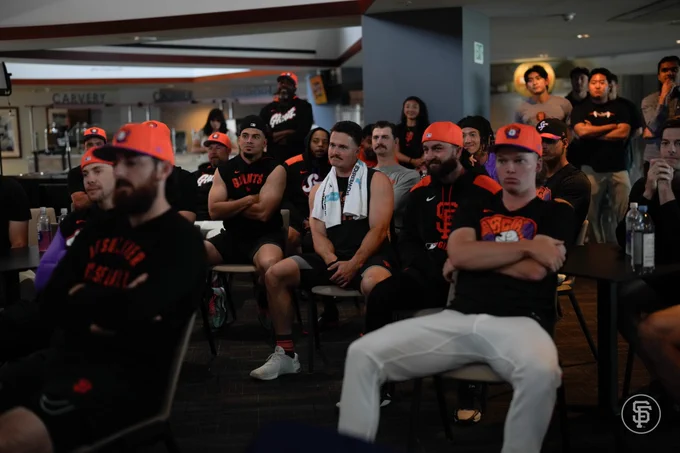 Giants players watching the Devers press conference