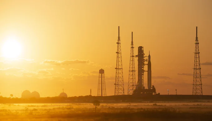 NASA’s Space Launch System (SLS) rocket with the Orion spacecraft aboard is seen at sunrise atop a mobile launcher at Launch Complex 39B, Monday, April 4, 2022, as the Artemis I launch team conducts the wet dress rehearsal test at NASA’s Kennedy Space Center in Florida. Ahead of NASA’s Artemis I flight test, the wet dress rehearsal will run the Artemis I launch team through operations to load propellant, conduct a full launch countdown, demonstrate the ability to recycle the countdown clock, and drain the tanks to practice timelines and procedures for launch.
Photo Credit: NASA/Joel Kowsky