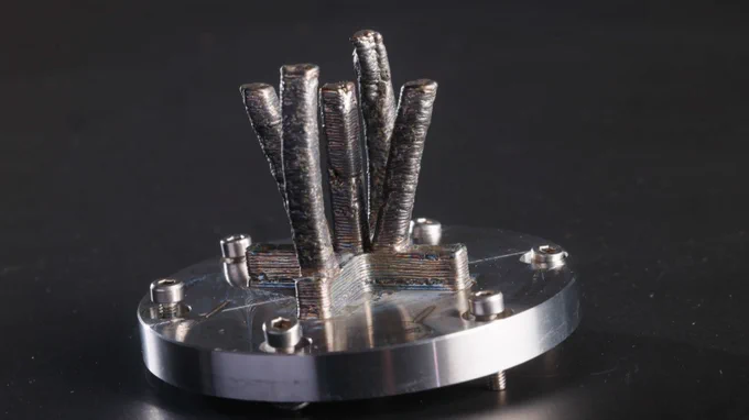 First metal part 3D printed in space.
