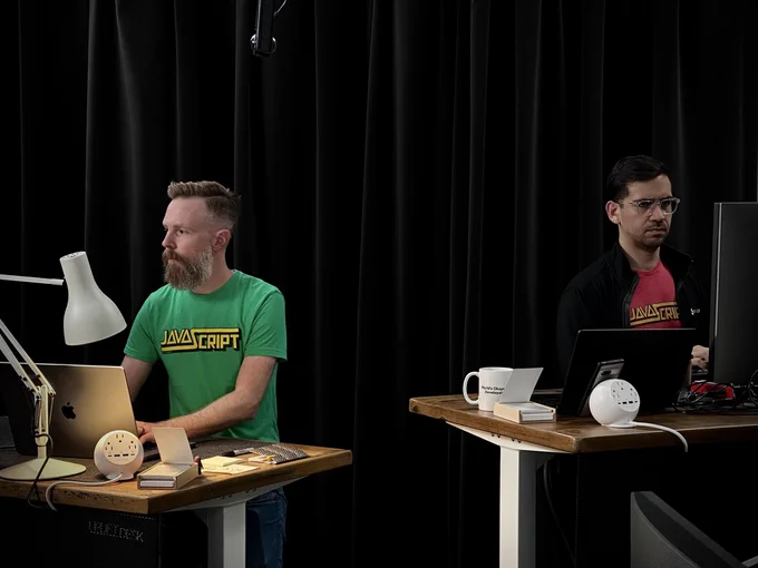 Stephen and David of the Keyframers working at desks in CodeTV Studio