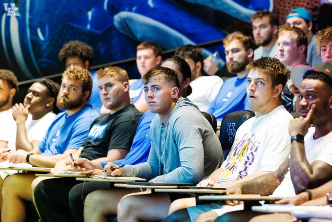 The team listening to David Cozart at 4 for 40. 