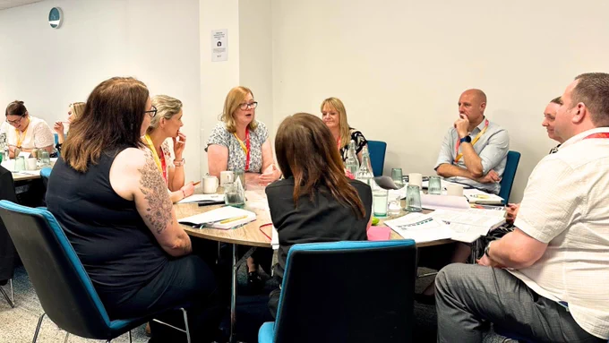 Leaders discussing together at a table