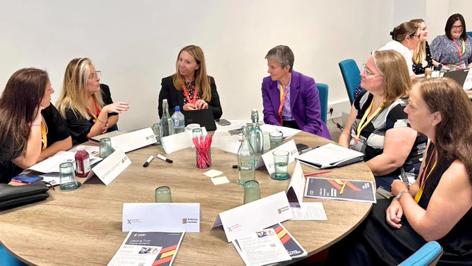 Leaders discussing together at a table
