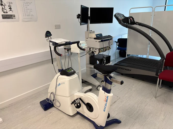 An exercise bike next to laboratory equipment. 