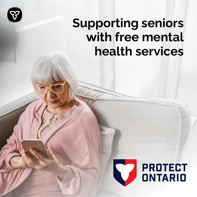 A senior citizen using a smartphone. Image Text: Supporting seniors with free mental health services.