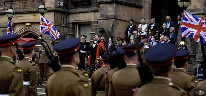 Mayor of St Helens Borough, Cllr Seve Gomez-Aspron, pictured on town hall steps with other council representatives, Lord Lieutenant, High Sheriff and others welcoming Duke of Lancaster Regiment in Victoria Square