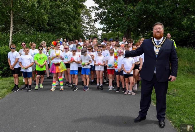 Mayor of St Helens Borough, Cllr Seve Gomez-Aspron pictured starting off the Colour Run race at Victoria Park