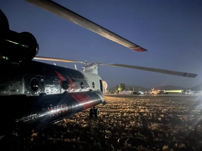The Boeing CH-47D Type 1 Helitanker is equipped for night vision goggle (NVG) operations and flies with a crew of three. It can carry and deliver up to 3,000 gallons of water or retardant in varied conditions, significantly extending operational effectiveness beyond traditional daylight hours.