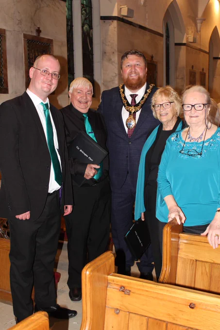 Mayor of St Helens Borough, Cllr Seve Gomez-Aspron, pictured with members of Pilkington Choir inside St Austin's Church