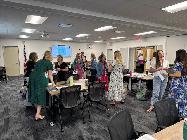 Truenorth staff and member district staff engaging in professional learning in conference rooms
