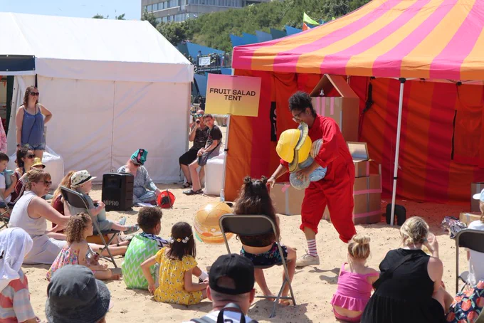 Performer carries DIY spaceship props