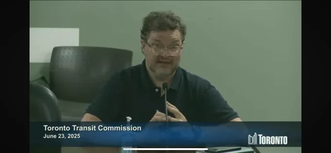 person speaking at microphone