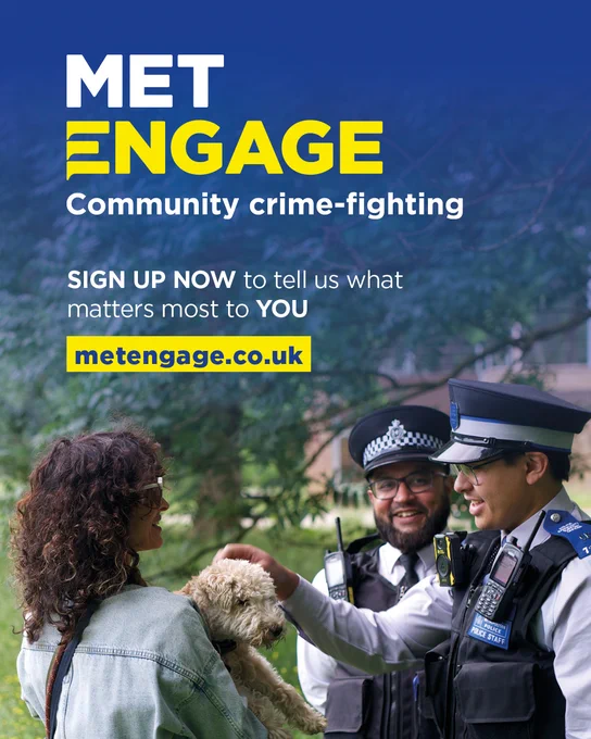 Two police officers in uniform stand in a local park and talk to a resident who is holding her dog in her arms. All are smiling. One of the officers is stroking the dog's head. The photo has yellow and white text over the top of a black gradient, which reads: "Met Engage: Community crime-fighting. Sign up now to tell us what matters to you most."