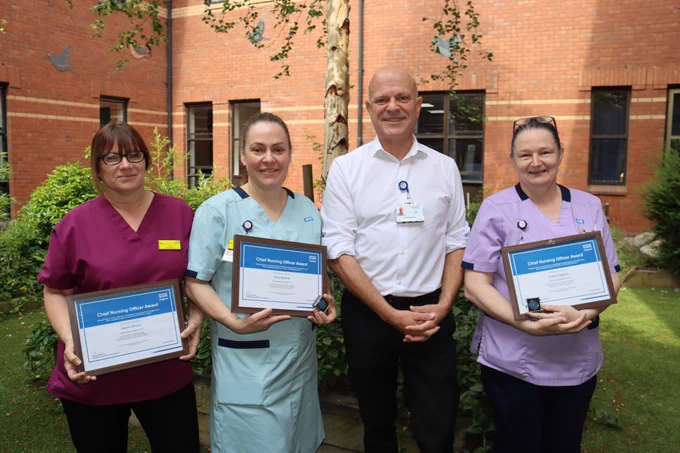 From left, Joanne Brown, Trina Starmer and Elaine Oughton (far right) receive their Chief Nursing Officer Silver Awards from Garry Marsh, UHDB Executive Chief Nurse
