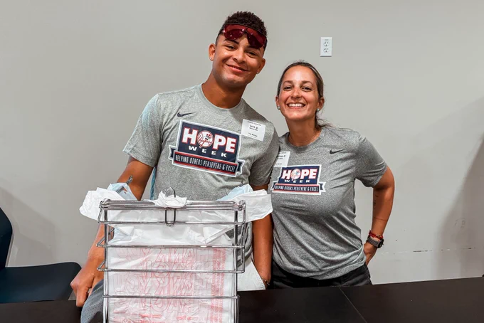 Two members of the Yankees organization at the Feeding Tampa Bay market.