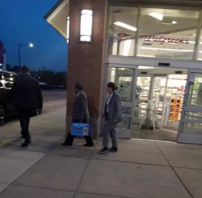photo of lori lightfoot walking out of walgreens with the 24 pack