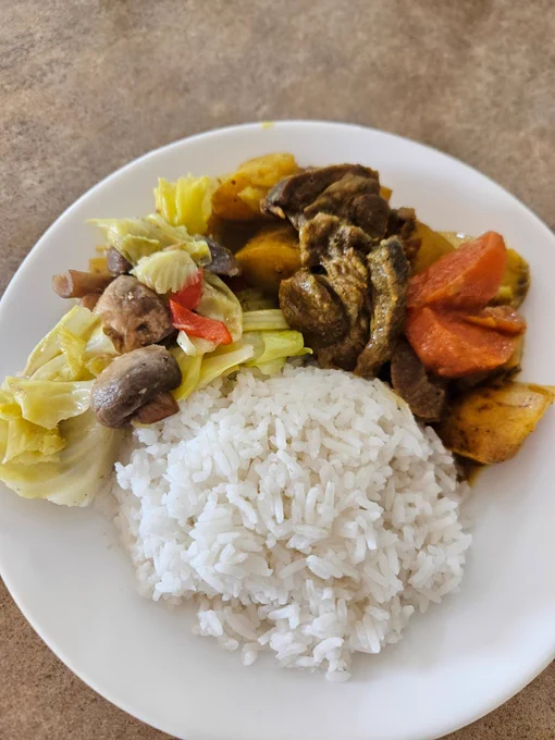 Dinner as described served on a round white soup plate.