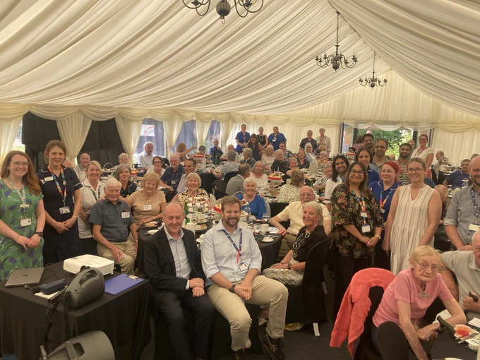 The group in the marquee at the secret garden