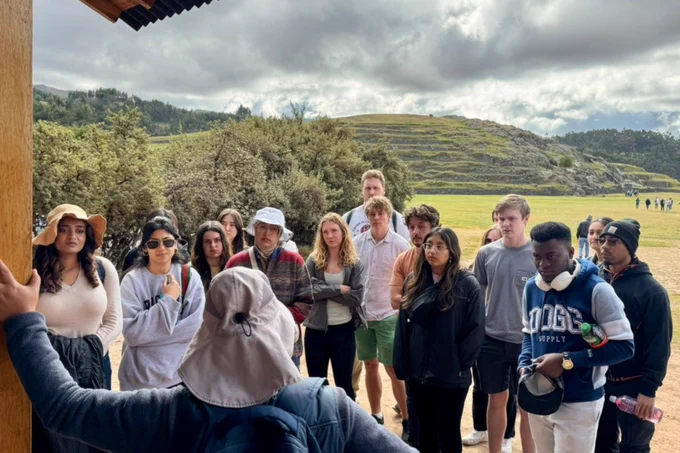 Virginia Tech ECE students listen to someone talking while in Peru.