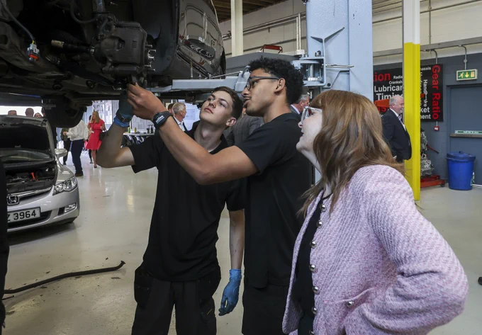 The Minister is pictured with Workforce Motor Vehicle apprentices Andrew Baker and Ali Ahmed
