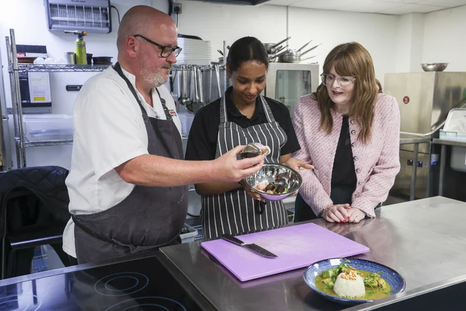 The Minister is pictured with catering tutor Paul Stewart and apprentice Waad Ibrahim
