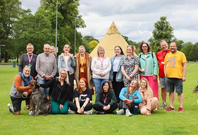 Our SAMH Perth teams stand in front of a tipi at the North Inch park