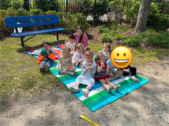 early childhood students enjoying a picnic outdoors