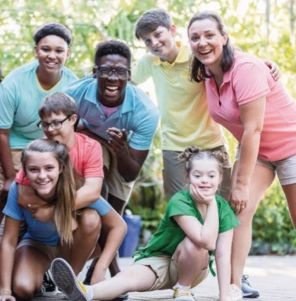 A group of happy kids of varying abilities are decked out for summer fun!
