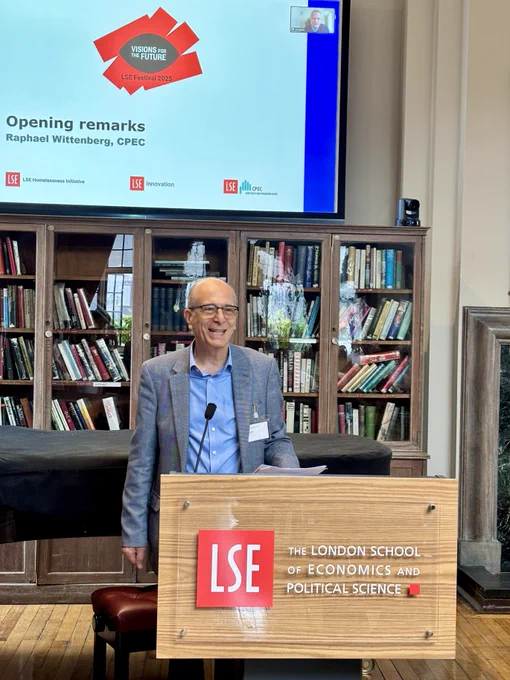 A photograph of CPEC deputy Director Raphael Wittenberg getting the event started. He is standing at the podium, delivering opening remarks.