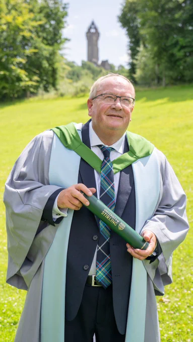 Paul Bush OBE pictured in front of the Wallace Monument.