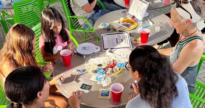 Family sitting around a table during an activity