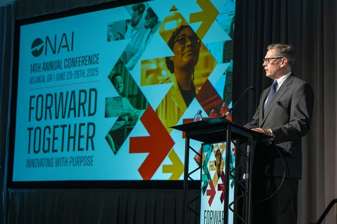 The U.S.P.T.O’s Will Covey stands at a podium during N.A.I. 2025.