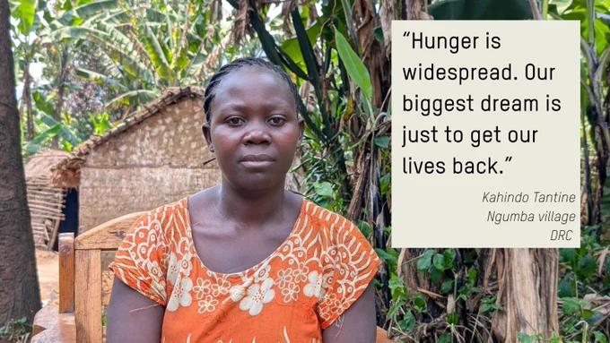 A woman wearing an orange patterned dress sits on a wooden chair in front of a thatched house, surrounded by lush green banana trees in Ngumba village, Democratic Republic of Congo. A quote beside her reads: “Hunger is widespread. Our biggest dream is just to get our lives back.” – Kahindo Tantine, Ngumba village, DRC.