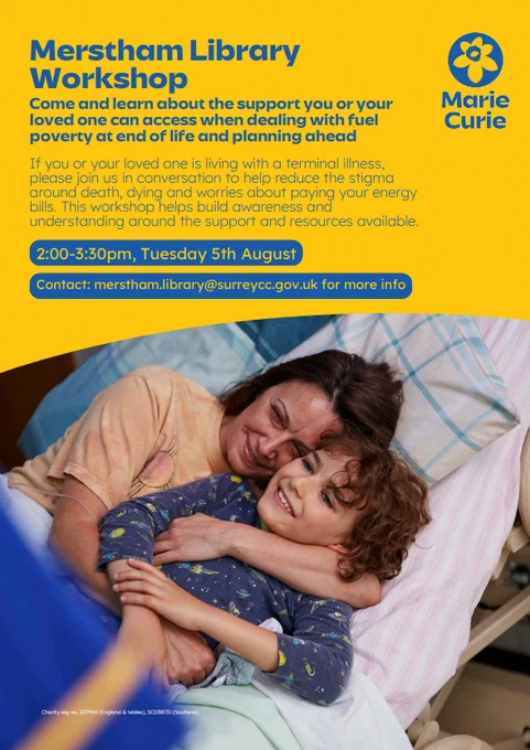 A lady and young boy are lying on a hospital bed cuddling and laughing