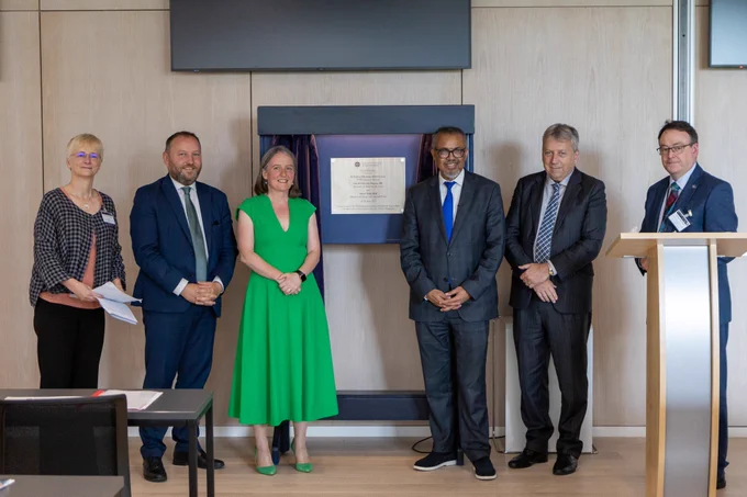 Left to Right, Professor Cathie Sudlow OBE, Director of the Usher Institute, Ian Murray Secretary of State for Scotland, Maree Todd MSP, Minister for Alcohol and Drugs, Dr Tedros Adhanom Ghebreyesus, Director General at WHO, Professor Sir Peter Mathieson, Principal and Vice-Chancellor at Edinburgh University and Professor David Argyle, Head of College of Medicine and Veterinary Medicine. The group smiles next to a commemorative plaque to mark the opening of the Usher Institute.
