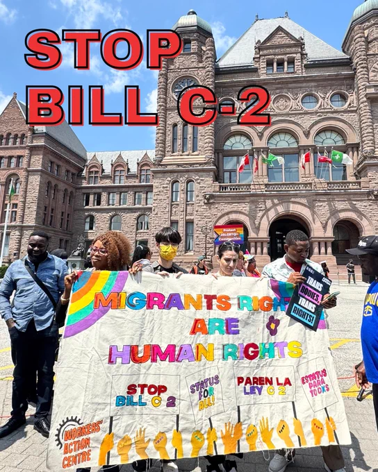 Stop Bill C-2: Image of a banner that says "Migrant Rights are Human Rights" held by WAC members and allies at a Queen's Park rally supporting LGBTQ  refugees and newcomers. 