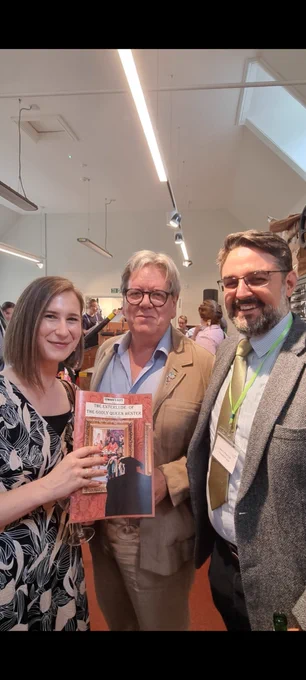 Perry Mills between Maria Shmygol and Jose A Perez Diez, pictured at the BSA reception, with the programme for The Enterlude of the Godly Queen Hester 