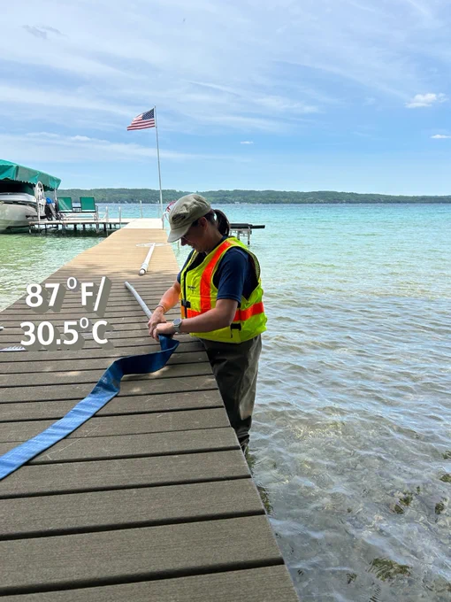 Stay in the shade when possible. (Sherry Martin (Lansing), prepping equipment at Torch Lake, 2024)
